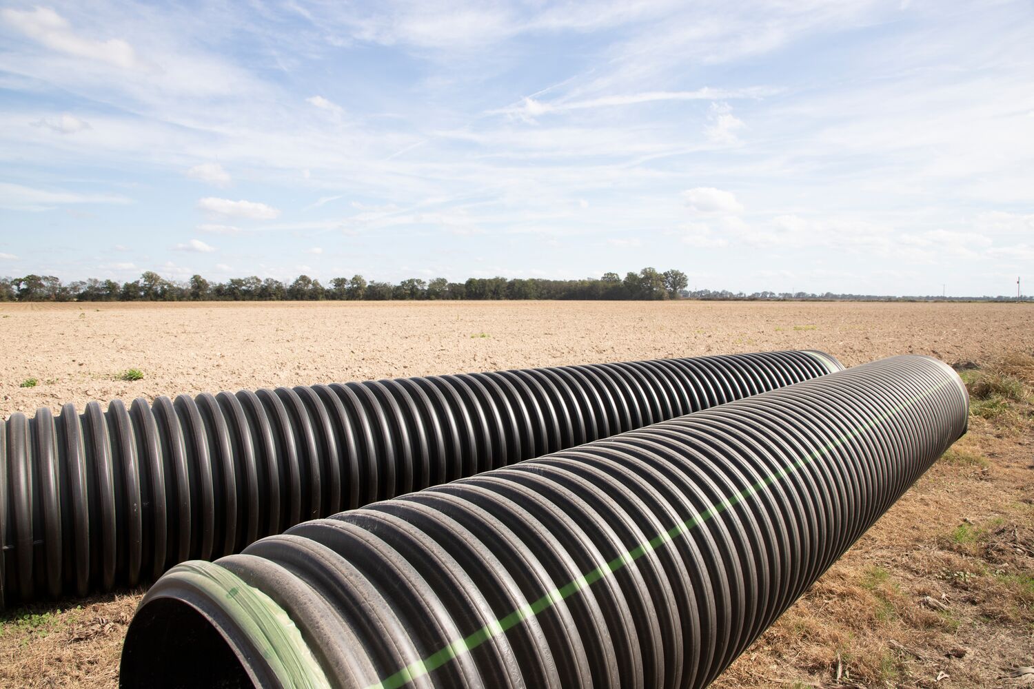 Large-Sticks of Pipe In Field