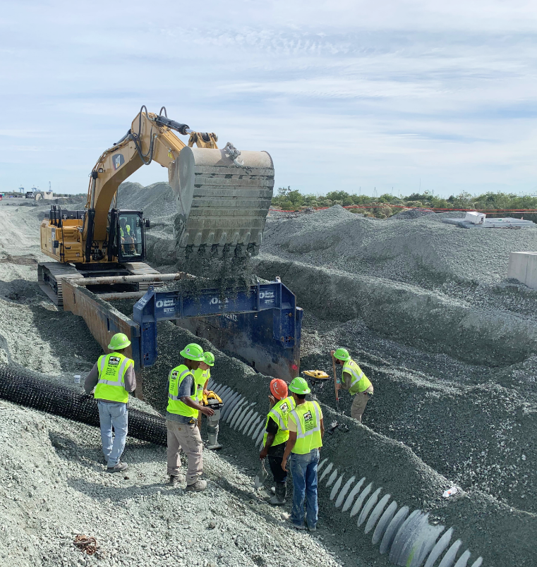 workers with a pipe and digger