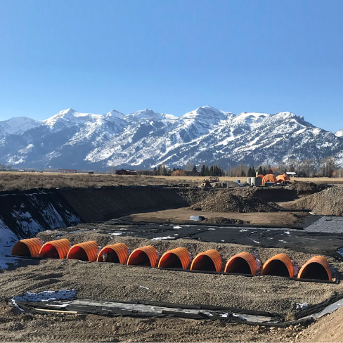 StormTech product in a field with mountains in the background